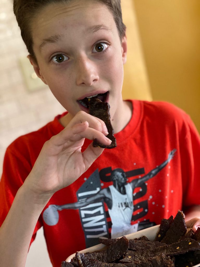 kid eating beef jerky